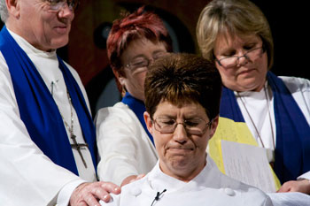Past Moderator, Rev Bruce Johnson, General Secretary, Dr Shirley Coulson, and Moderator\\\'s Chaplain, Sharon Kirk, join the congregation of the 29th Synod celebration to pray for new Moderator, Rev Kaye Ronalds. Photo by Osker Lau