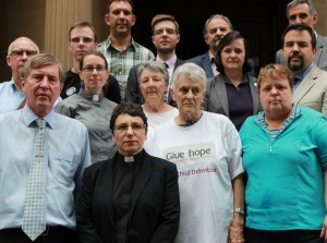 Elenie Poulos and supporters present the Uniting Church offer of sanctuary for unaccompanied minors currently held on Christmas Island. 