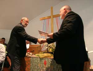 Rev Dr David Pitman congratulates Rev Robert Griffiths on his retirment. Photo by Osker Lau