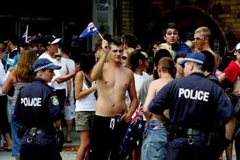 Police officers hold back the crowd at Cronulla railway station in Sydney December 2005 AAP/Paul Muller © 2006 AAP