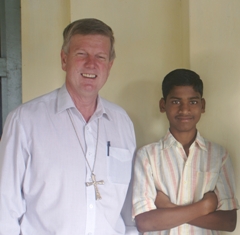Uniting Church President Rev Gregor Henderson with a young man who lost all of his famiy in the 2004 Boxing Day tsunami, Machilpatnam, in the Diocese of Krishna Godavari.