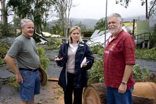 The Gap Uniting Church member Ian Orchard, local member Kate Jones MP, and The Gap Uniting Church Finance and Property Committee Chairperson Ian Hayes inspect the damage. Photo by Mardi Lumsden