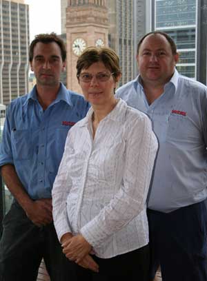Adrian Bateup, Lyn Burden, and Brett Eldred on top of the new Wesley House, Brisbane. Photo by Mardi Lumsden