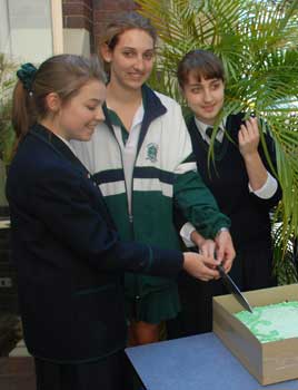 Somerville House students cut the Chapel’s birthday cake. Photo by Stephanie Grorud and courtesy of Somerville House