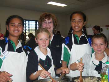 Tongan students enjoy a cooking class with students from Unity College. Photo courtesy of Judy Morrison and Unity College