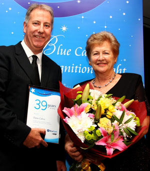 Blue Care Executive Director Steve Muggleton awards Elaine Cabria. Photo courtesy of Blue Care