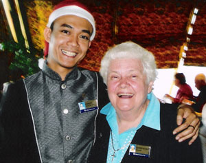 Rev Bev Ham, right, celebrates Christmas with one of the ship’s dining stewards. Photo courtesy of Bev Ham 