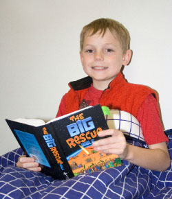 Chris from St Mark's Mt Gravatt snuggles up with a good book. Photo by Bruce Mullan