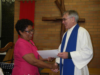 Salote Tuinona is congratulated by Moderator Rev Bruce Johnson. Photo by Gary Garner