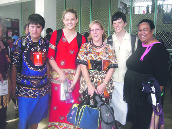 Unity College students Ellen Brodrick (left) and Jason Butler, with teacher Lisa Farrell and Peteli Middle School Principal Komisi Fihaki (right). Photo by Judy Morrison