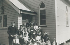 Rev Ron Smith (left) with the members of the Longreach Sunday School and Youth Group. Taken on a box brownie circa 1953.  Photo courtesy of Phil Smith