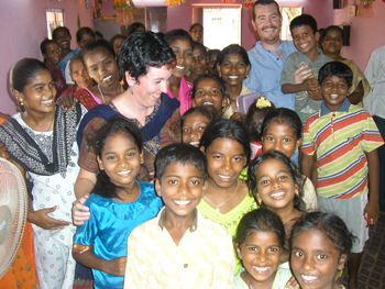 Sue and Alan Pickering with women and children in India in 2007. Photo courtesy of Sue Pickering 