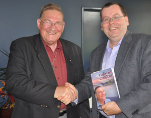 David Busch (right) congratulates Rev John Mavor at the launch of his autobiography. Photo by Glenn Mulcahy