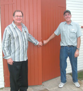 Cr Kevin Casey, left, representing the Mackay Regional Council who provided a $5000 grant  to equip the Iona West Men\\\\\\\'s Shed opens the doors with Rev Euan McDonald.