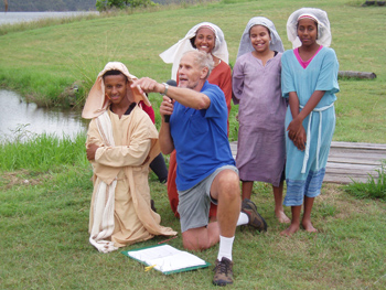 Moogerah Passion Play director, Tony Barnes, rehearses with young actors. Photo courtesy of Carroll Simons 
