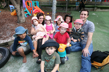 Toowong Child Care Centre’s Natalie Potter (back left) with children and parent Justin Musgrave. Photo by Osker Lau