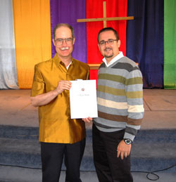 Dr Dennis Shanks receives his accreditation from Dr Aaron Ghiloni. Photo by Lulu Shanks 