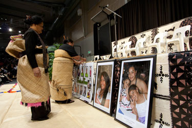 Women decorate the front of the hall for the Community Prayer Gathering at the Logan Metro Sports Centre. Photo by Osker Lau