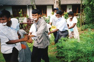 Young people in Sri Lanka participate in a trust-building activity as part of the peace-building program. Photo courtesy of Young Ambassadors for Peace