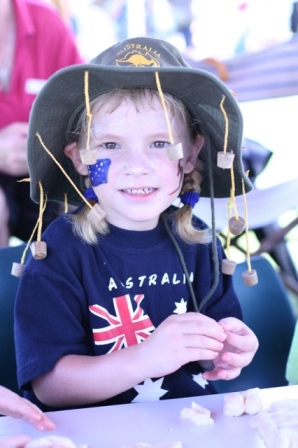 Five year old Maddie Armstrong making damper at the Big Aussie 