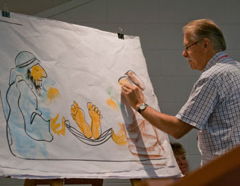 Rev Alan Robinson presents a Bible reading. Photo by Osker Lau