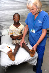 Robyn Porep with one of her patients, Sahr, who spent five months recovering from surgery to straighten both legs.