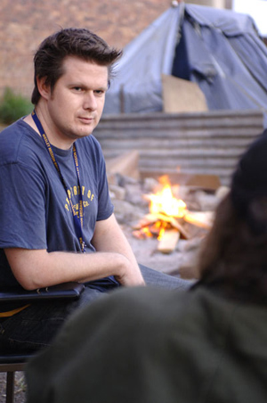 Rev Tim Hodgson talks with ‘residents’ of a homeless tent village in South Brisbane. Photo courtesy of Wesley Mission Brisbane