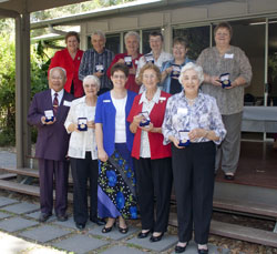 Margaret Sear was recognised for her commitment to an Nine of the 11 recipients of the Moderator’s Community Service Medals with UnitingCare Qld CEO, Anne Cross, back left, and Moderator, Rev Kaye Ronalds, front centre. Photo by Osker Lau 