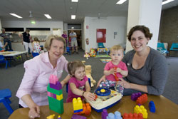 Volunteer, Gaylynn Bailey, with Sasha, Lillian, and Kitty Kendall at playgroup. Photo by Osker Lau