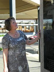 The Downs Presbytery Minister, Sharon Kirk, inspects the plaque erected in Toowoomba to commemorate the events of January 2011. Photo by David Kirk