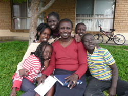 Amel Manyon, pictured with some of her family, has become Australia’s first ordained woman from South Sudan. Photo by Jade Kearns