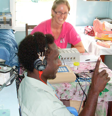 Emmanuel Uniting Church, Enoggera, member and audiologist Annette Kaspar conducts hearing tests on Solomon Islands nurse Stephen Heshibo. Photo courtesy of Annette Kaspar