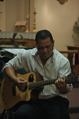 Guitarist Eric Barkmeyer performs at the service at Enoggera’s St John the Evangelist Anglican Church. Photo by Michael Stephenson