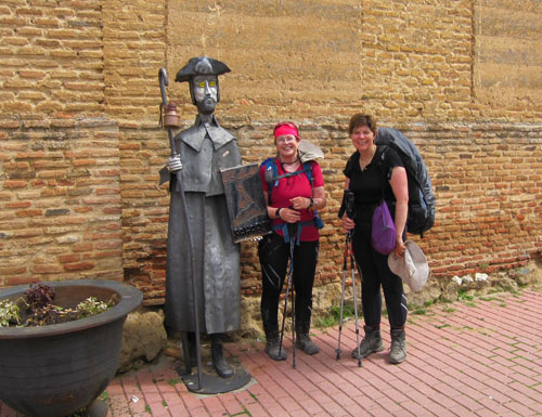 Queensland Synod General Secretary Dr Shirley Coulson and Wesley Mission Brisbane Superintendent Minister Rev Lyn Burden at Sahagún in the province of León on the last day of their pilgrimage. The pilgrim statue is outside the 13th century Iglesia de la Trinidad, which houses one of the town’s pilgrim hostels or “albergues”. Photo courtesy of Dr Coulson and Ms Burden