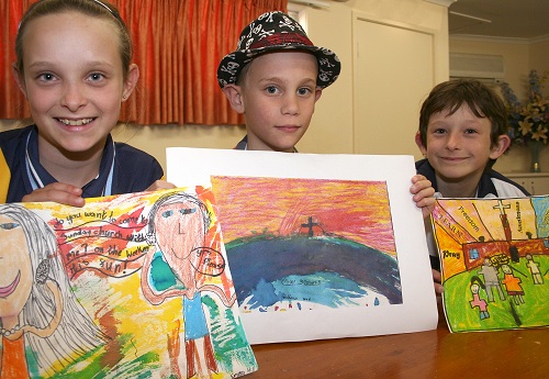 Emma, Adrian and Jacob with their winning artworks. Photo by Holly Jewell