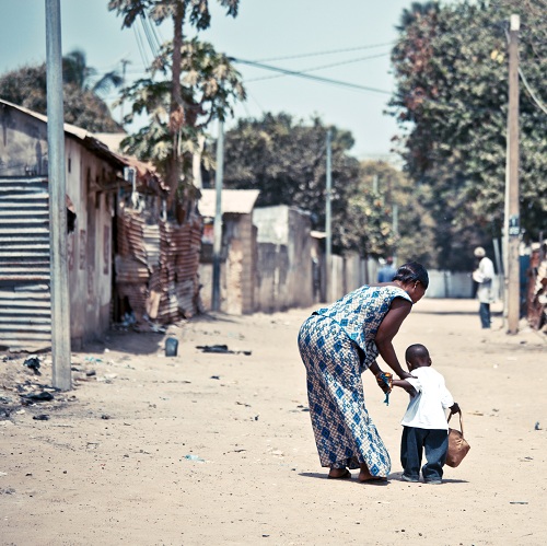 Mother and child on the streets of Jeswang, Gambia. Photo courtesy of iStockphoto