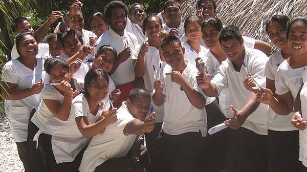 Simple items like pens can help support overseas partners such as these students at the Tangintebu Theological College in Kiribati. Photo: UnitingWorld