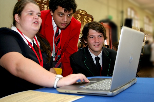 Ailish (St Margaret’s School, Brisbane ) Emile (St John’s Anglican College, Forest Lake) and Kyle (Unity College, Caloundra) work together on an interactive activity at the One World, WonTok Youth Conference on Poverty and Development in Brisbane. Photo: Holly Jewell