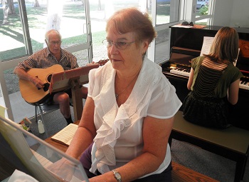 Alan Tangye and Pam Jensen enjoy music ministry at Mackay Uniting Chruch Photo: Ron Kirkpatrick
