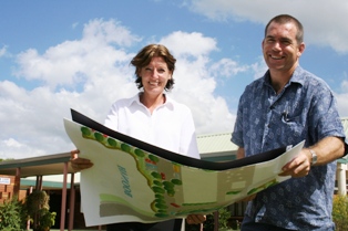 Blue Care Fassifern Director of Nursing Janelle McClure and Boonah Uniting Church congregation’s Reverend James Matthews look over some of the development plans that will be on display at the vergola opening.