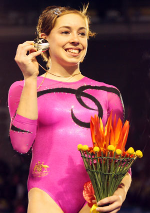 MBC gymnast Chloe Sims shows off her gold medal for the women’s all-around competition at the 2006 Commonwealth Games. Photo courtesy of Nicolas Ng www.nkphotos.co.uk