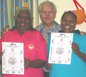 From left: Ellen Roughsey (left), College Principal Rev Michael Connolly and fellow student Evette Pamela Mundraby from Yarrabah