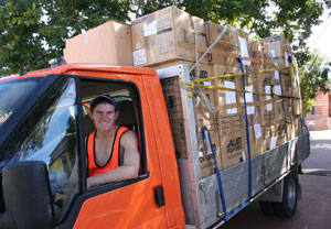 One of the truckloads of school supplies leaves the Synod Office. Photo by Osker Lau 