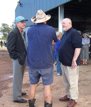 Rev Iain Watt (left) and the Moderator in conversation with a Mary Valley dairy farmer