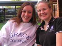 Students Ashley and Roesmary proudly wear the Grace College label