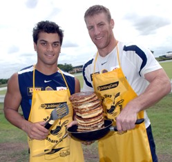 Brisbane Broncos Karmichael Hunt and Brad Thorn enjoying today’s Pancake Day launch. 