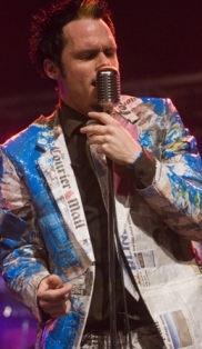 Craig Burnett lead singer for SCAT in his fancy pants newspaper suits 