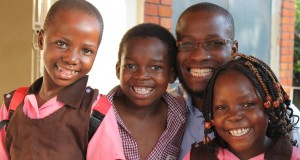 Allan, centre, with Pastor Peter Sewakiryanga and other children saved from child sacrifice by Kyampisi Childcare Ministries