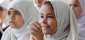 Adela, a nine-year-old Afghan girl in class at Charbagh-E-Safa Girls High School in Jalalabad. Photo by Act for Peace