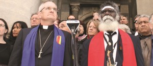 Rev Dr Andrew Dutney and Rev Rronang Garrawurra lament with members of the 13th Assembly in front of Parliament House in Adelaide, 2012.